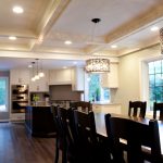 Wood table with white coffered ceilings above