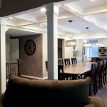 Looking into the dining room through white trimmed columns