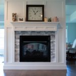 See thru fireplace with wood trim surround