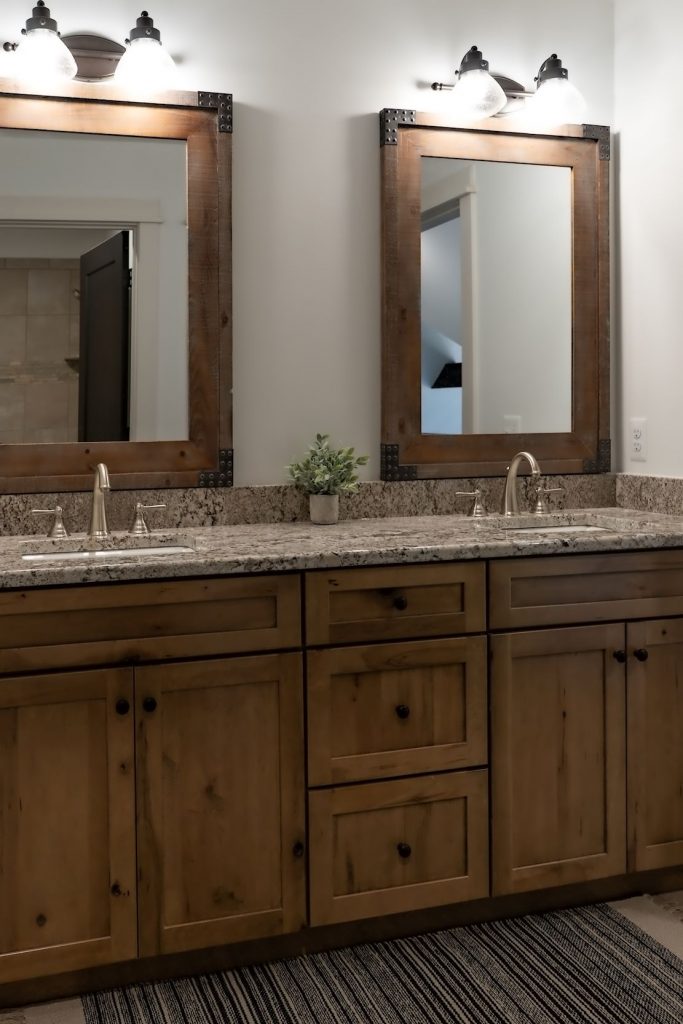 knotty pine cabinets with wood trimmed mirrors