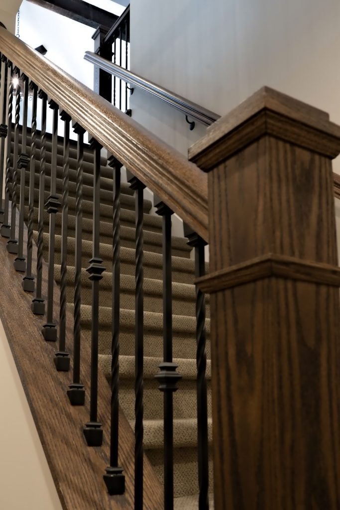 Oak Newel post and hand rail with iron ballusters