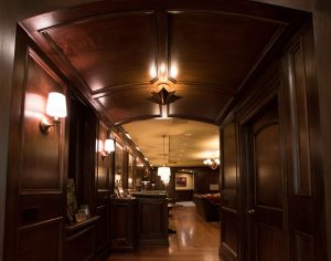 Curved wood paneled ceiling at entry to ballroom