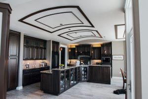 Dark wood cabinet kitchen with curved ceilings